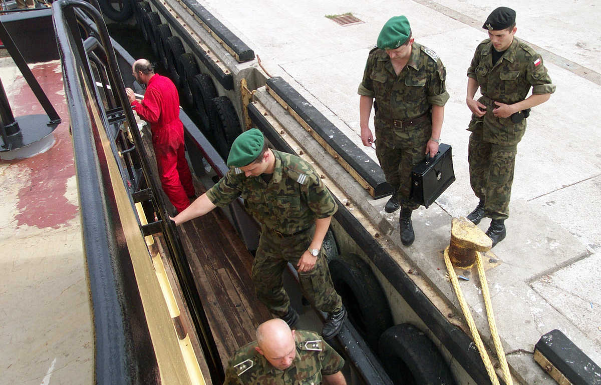 policemen entering the ship