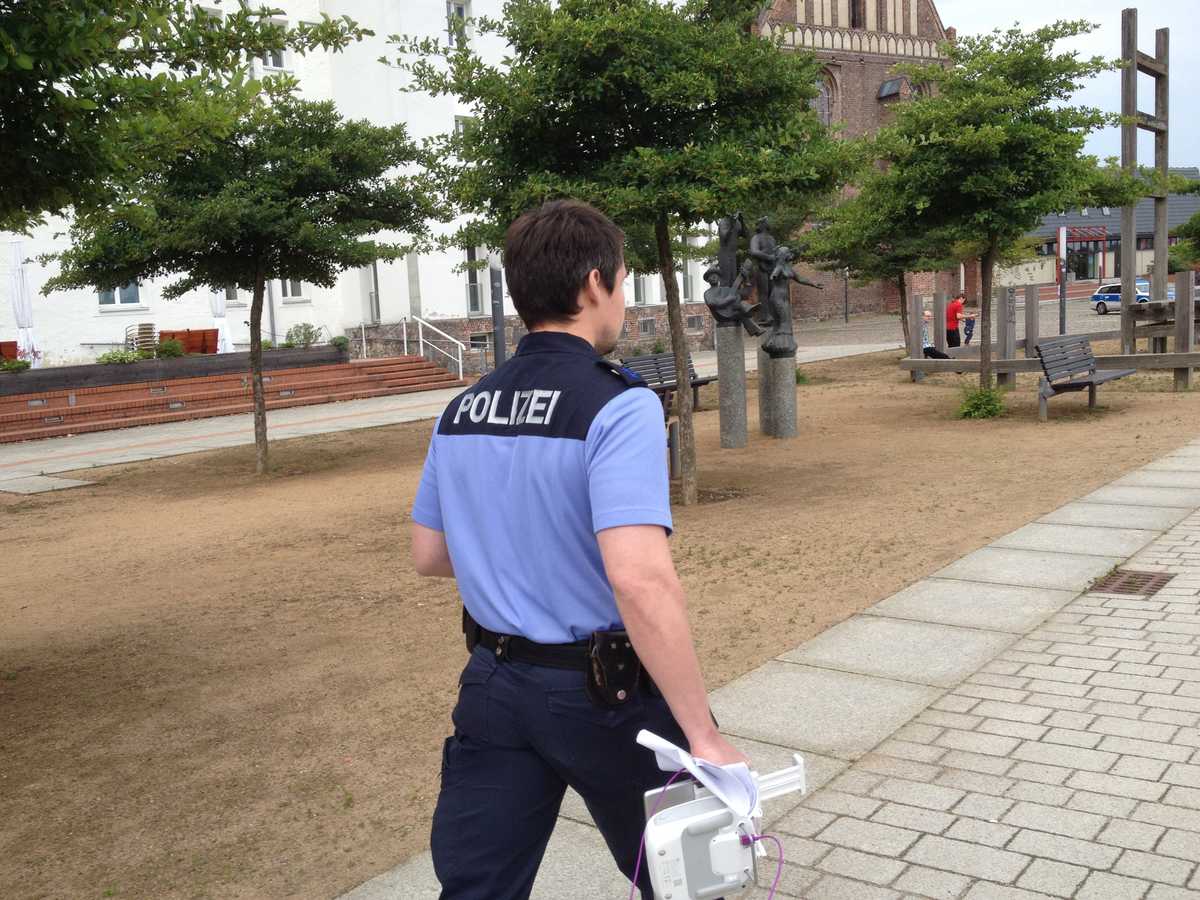 German police officers confiscating the drone controller